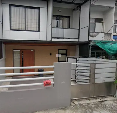 an outside view of a building with a fence at Smile Residence at Kaset-Sena in Ban Yang