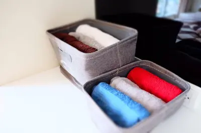 a box of different colored towels sitting on a table at HIGH RISE LUXURY CONDO 1BED ROOF TOP POOL 2 MinMRT in Bangkok