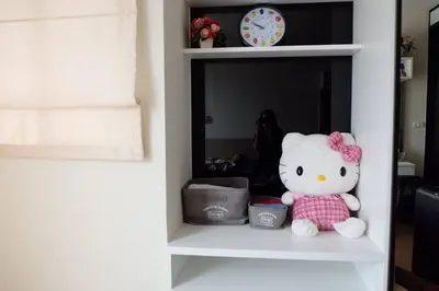 a stuffed teddy bear sitting on a shelf at HIGH RISE LUXURY CONDO 1BED ROOF TOP POOL 2 MinMRT in Bangkok