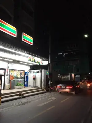 a car parked in front of a gas station at night at HIGH RISE LUXURY CONDO 1BED ROOF TOP POOL 2 MinMRT in Bangkok