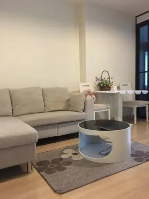 a living room with a couch and a bowl on a rug at HIGH RISE LUXURY CONDO 1BED ROOF TOP POOL 2 MinMRT in Bangkok