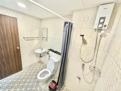 a bathroom with a toilet and a sink and a shower at Baan at Khaosan Hostel in Bangkok
