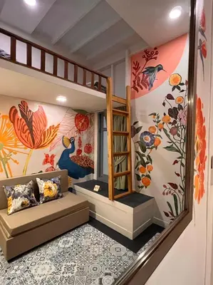 a childs room with a bunk bed and a staircase at Suraya Bangkok in Bangkok