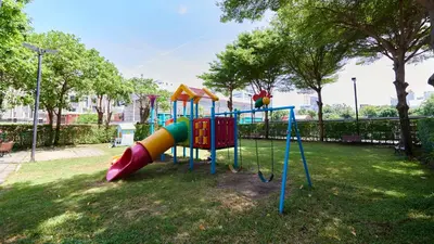 a playground with a slide in a park at Citiresort Living sukhumvit 39 in Makkasan
