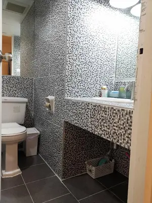 a bathroom with a shower and a toilet and a sink at Cozy 1br walk to BTS and Airport Rail Link Close to Malls m11 in Bangkok