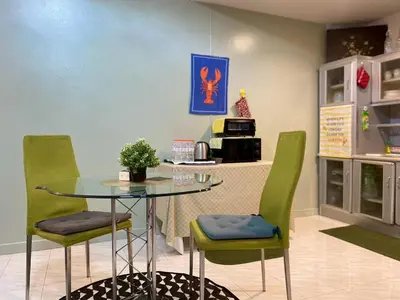 a dining room with a table and two chairs at Cozy 1br walk to BTS and Airport Rail Link Close to Malls m11 in Bangkok