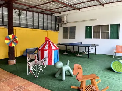 a room with a tent and a ping pong table at K house in Ban Bang Khen (1)