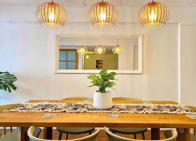 a dining room table with a potted plant on it at Flip Flop In Townhouse in Bangkok