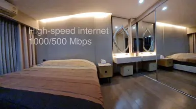 a room with a bed and two sinks and mirrors at 1BR Thonglor , Fast WiFi , Near Samitivej , Nightlife in Khlong Toei