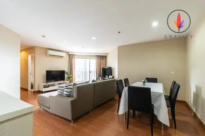a living room with a couch and a table at MRT rame9 Jodd Fairs night market, walk for a few minutes, two bedrooms and two bathrooms in Ban Don Sai