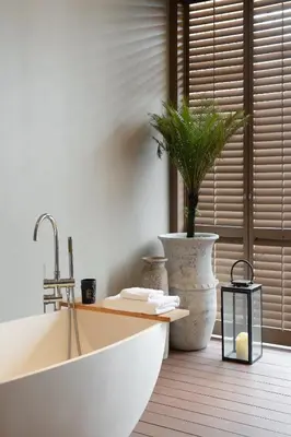 a kitchen with a sink and a potted plant at Stay Plus Hotel Bangkok in Bangkok