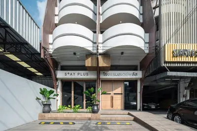 a building with a sign that reads stay plus at Stay Plus Hotel Bangkok in Bangkok