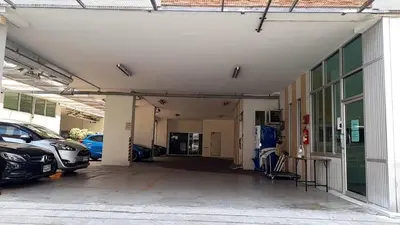 an empty garage with cars parked in it at Love mansion in Bangkok