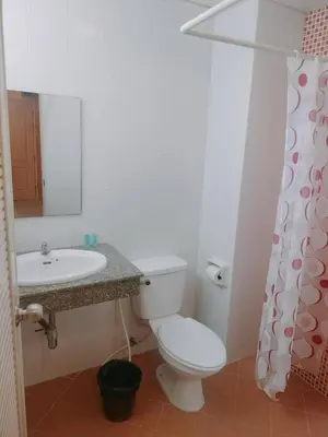 a bathroom with a toilet and a sink at Love mansion in Bangkok