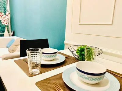 a table with two bowls and plates on it at interLux Premier Sukumvit , Nana , Bangkok in Bangkok