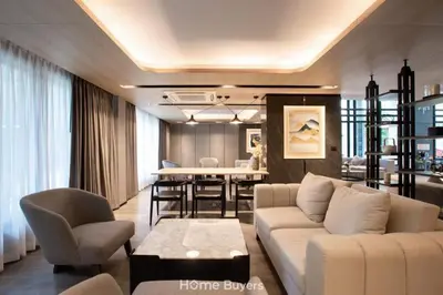 a living room with a couch and a dining room at Monte Rama 9 near JodFair Market Condo in Bangkok