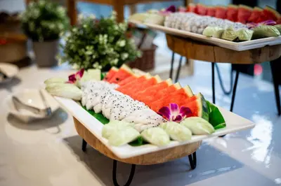 a table with two trays of food on display at SAM E Hotel Bangkok Sathorn in Bangkok