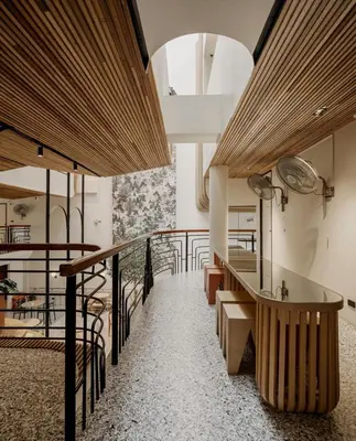 a staircase in a building with wooden ceilings at Double B Hostel in Bangkok