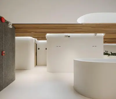 a row of white refrigerators in a room at Double B Hostel in Bangkok