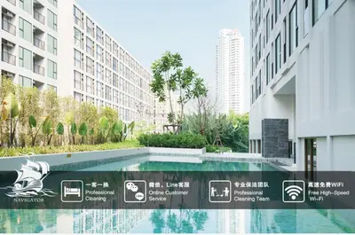 a swimming pool in the middle of a building at Sathon-Charoen Nakhon Condo in Bangkok