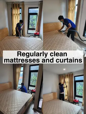 a man is painting a bed in a room at Sathon-Charoen Nakhon Condo in Bangkok