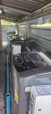 a row of printers sitting in a garage at 206 Lovely Room with cool fan with full amenities & Free Wi-Fi in Bangkok