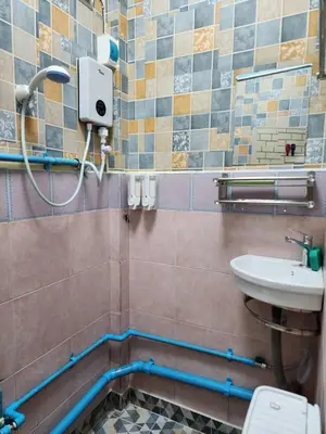 a bathroom with a sink and a toilet at 206 Lovely Room with cool fan with full amenities & Free Wi-Fi in Bangkok