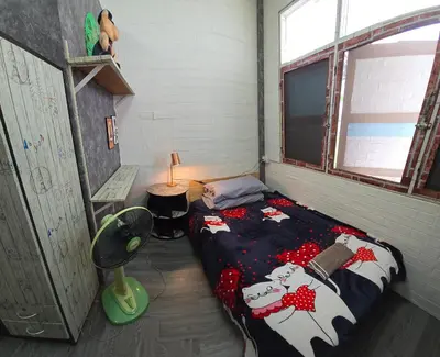 a room with a bed with a cow blanket at 206 Lovely Room with cool fan with full amenities & Free Wi-Fi in Bangkok