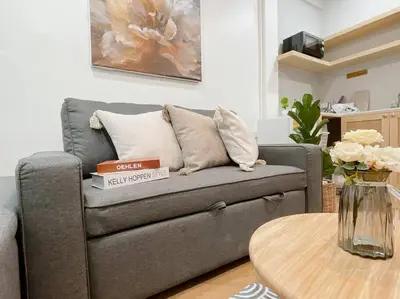 a living room with a couch and a table at Unwind in oldtown, private floor, near Grand Palace in Bangkok