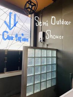 a group of glass panels on the wall of a store at Enterspace Chinatown in Khlong San