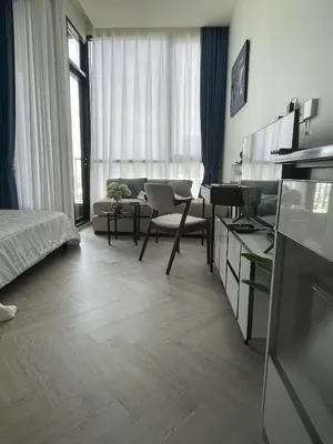 a living room with a bed and a room with a couch at Luxury River View in Bangkok