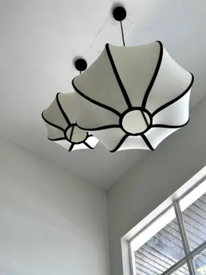 a chandelier hanging from a ceiling in a room at Oasis townhouse in the perfect location in Bangkok
