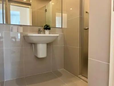 a bathroom with a sink and a shower at Ramkhamhaeng Condo in Bangkok