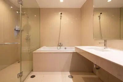 a bathroom with a tub and a sink and a shower at M Estate Private Residence 3BR, Heart of Bangkok in Bangkok