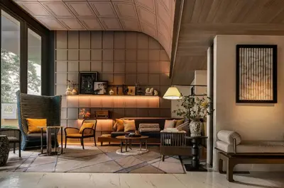 a living room with a couch and chairs at Madi Paidi Bangkok, Autograph Collection in Bangkok