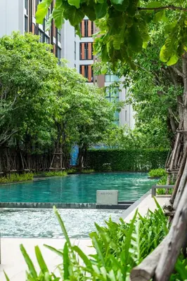 a swimming pool in the middle of a city at Bts thonglo 700m free wifi & gym in Ban Hua Khao Sisiat