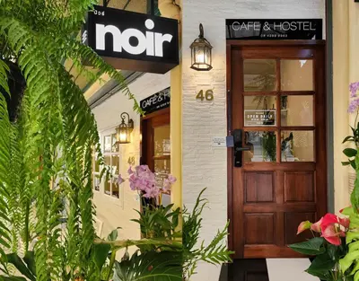 a not sign on the door of a coffee shop at Noir Cafe And Hostel Chinatown Bangkok in Chinatown