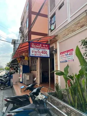 a group of scooters parked outside of a building at Pimravee Apartment (Yaek 8) in Ban Zong Katiam