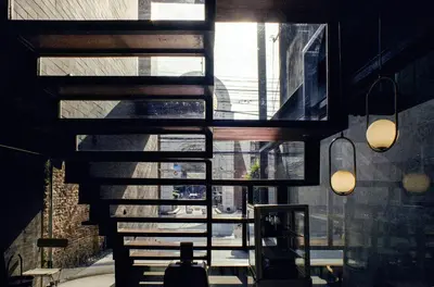 a room with a view of a building with windows at Na Tanao 1969 in Bangkok