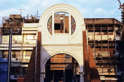 a building with a dog in the window of it at Na Tanao 1969 in Bangkok