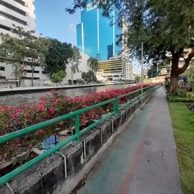 a long row of pink flowers on a fence at Worakarn Apartment 3 in Bangkok