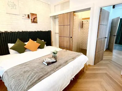 a bedroom with a bed with a tray on it at Entire floor,Decorated cozy home, near Grand Palace in Bangkok