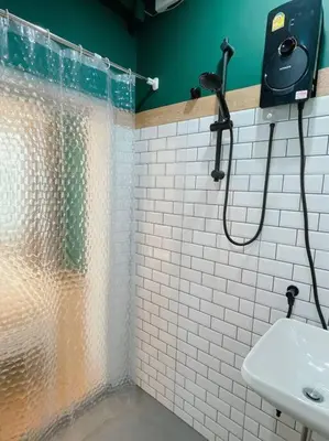 a bathroom with a shower and a sink at Entire floor,Decorated cozy home, near Grand Palace in Bangkok