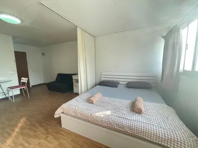 a bedroom with a bed with two pillows on it at Popular The best muangthongthani \u65e5\u5e38\u623f\u95f4\u516c\u5bd3 in Ban Bang Phang