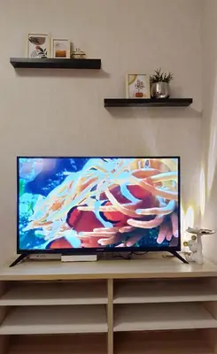 a flat screen tv sitting on top of a table at Elio Del Ray condo feel resort in Bangkok
