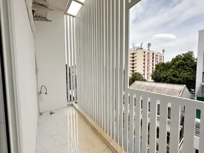 a balcony with a view of a building at Na Ekkamai Residence in Bangkok