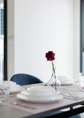 a vase with a flower in it sitting on a table at 2 bedrooms -1 living room and 1 bathroom - swimming pool in Ban Rang Sai (2)