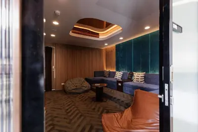 a living room with a couch and a chair at 2 bedrooms -1 living room and 1 bathroom - swimming pool in Ban Rang Sai (2)