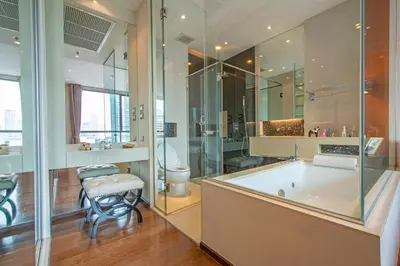a large bathroom with a tub and a toilet at Luxury 1BR 300m BTS PhromPhong, Empo, EmQ, EmSphere, Rooftop Pool, Gym, Fast 500mbps wifi in Bangkok