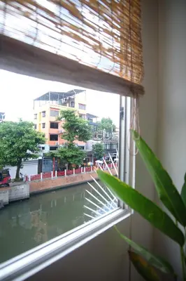 a window with a view of a river at SANT Bangkok at Khaosan Road in Bangkok
